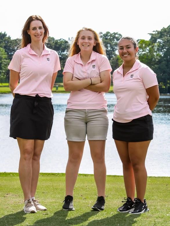 Girls Golf players standing on the field